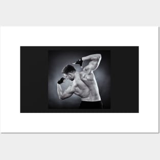 Athletic man doing bodybuilding moves Posters and Art